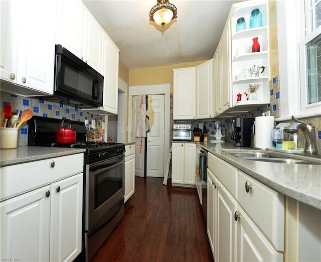 kitchen featuring decorative backsplash, sink, dark wood-type flooring, stainless steel gas range, and white cabinets