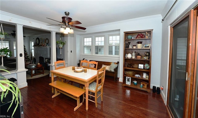 dining area with ceiling fan, dark hardwood / wood-style flooring, and crown molding