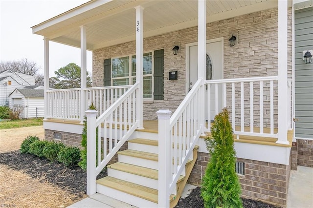 entrance to property featuring covered porch