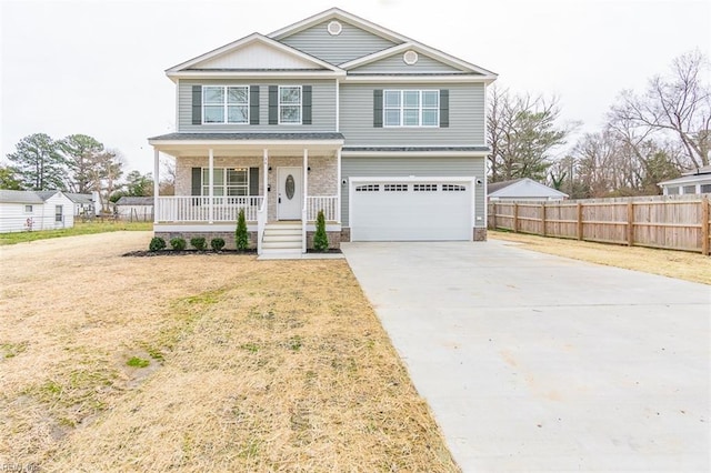 front facade with a garage, a front lawn, and a porch