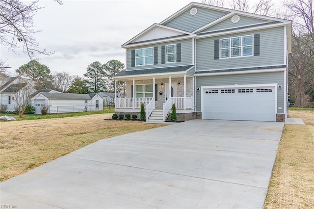 view of front of home featuring a garage, a front lawn, and covered porch