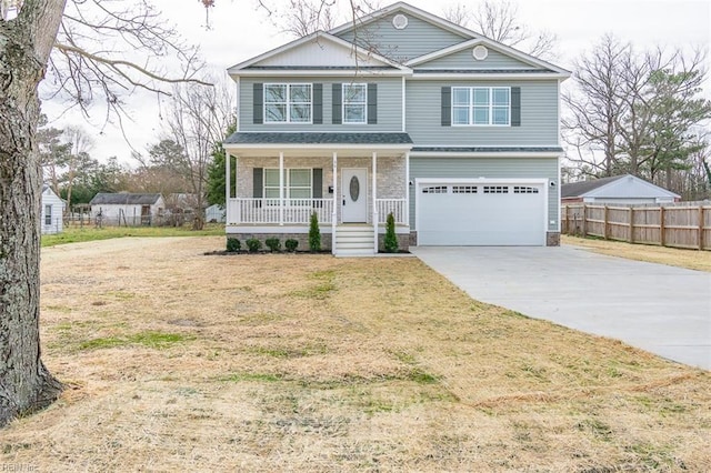 view of property with a front yard, a garage, and a porch