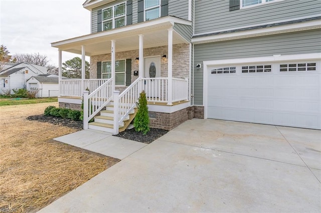 view of front facade with a porch and a garage