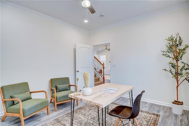 office with ceiling fan, ornamental molding, and wood-type flooring