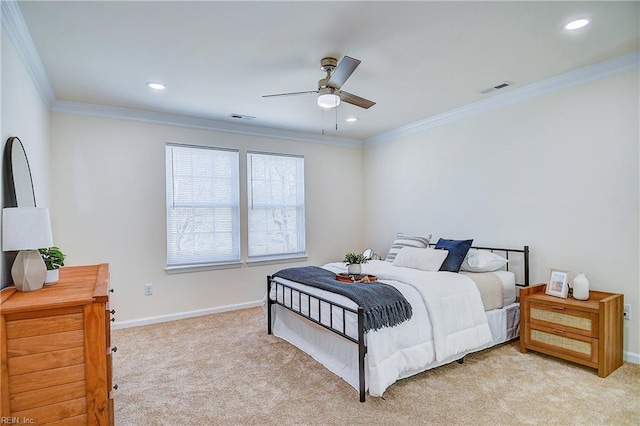 bedroom featuring ceiling fan, ornamental molding, and light colored carpet