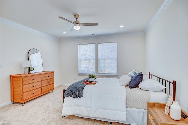 carpeted bedroom with ceiling fan and ornamental molding