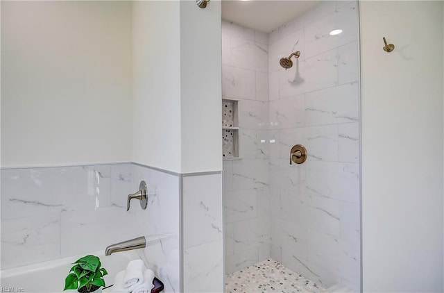 bathroom with a tile shower