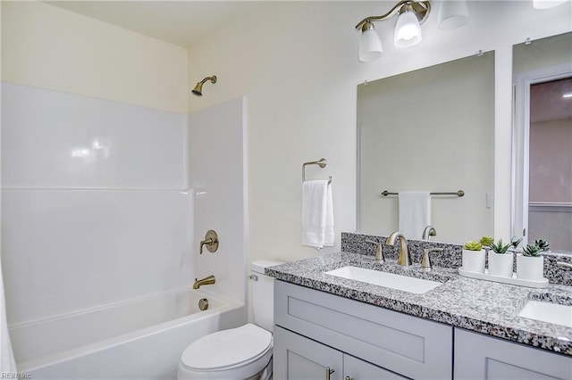 full bathroom featuring toilet, shower / bath combination, and vanity