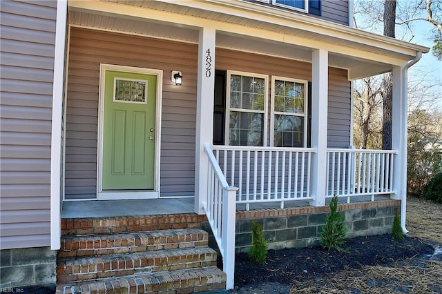 entrance to property with a porch