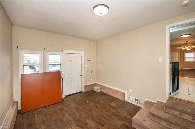 foyer entrance with dark wood-type flooring