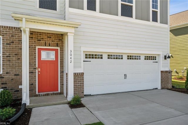 view of exterior entry featuring a garage