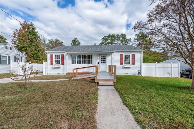 bungalow with a front yard