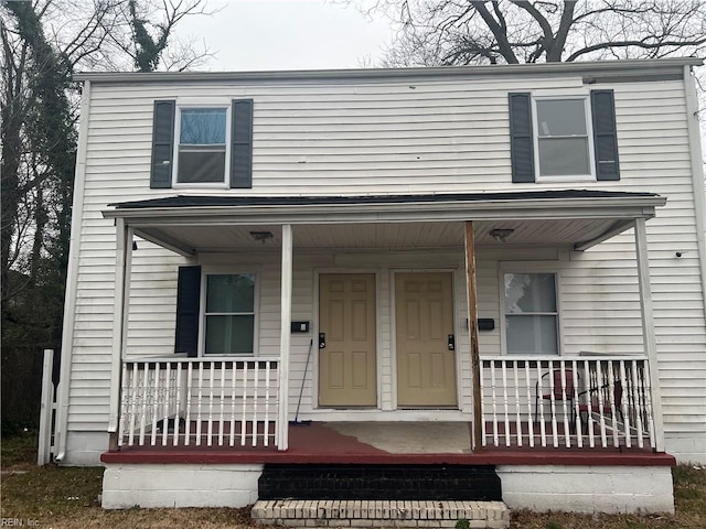 view of front property featuring covered porch