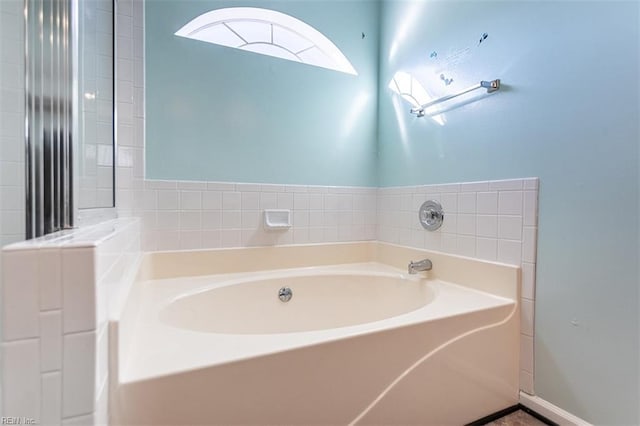 bathroom featuring a tub