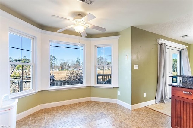 interior space with ceiling fan and a healthy amount of sunlight