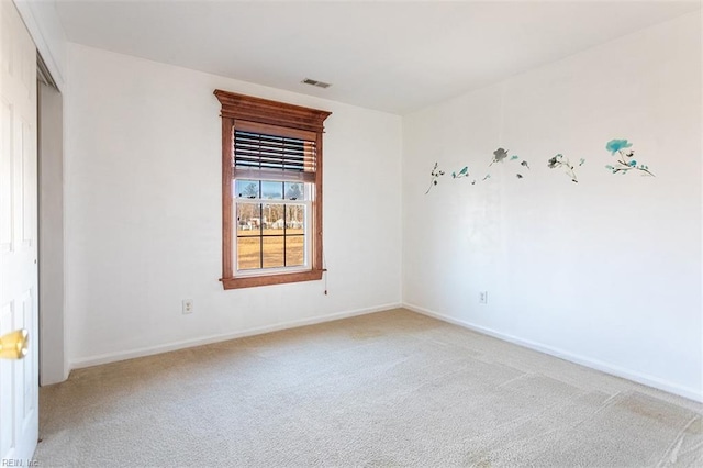 empty room featuring light carpet