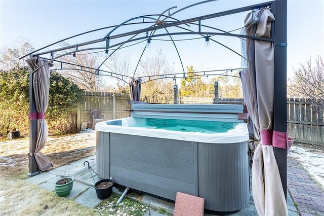 view of patio / terrace featuring a hot tub