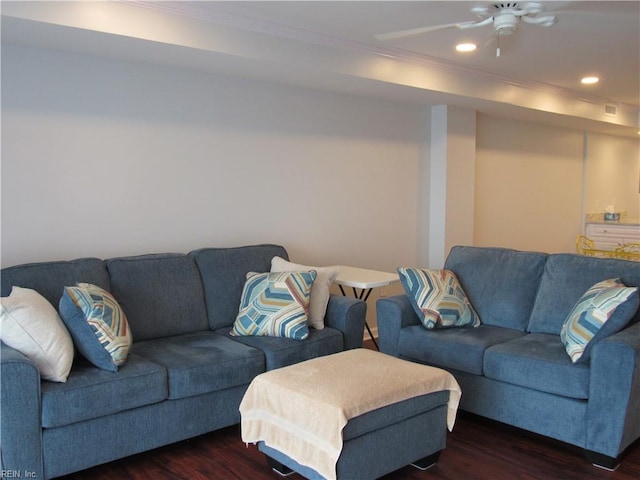 living room featuring ceiling fan, dark hardwood / wood-style floors, and ornamental molding