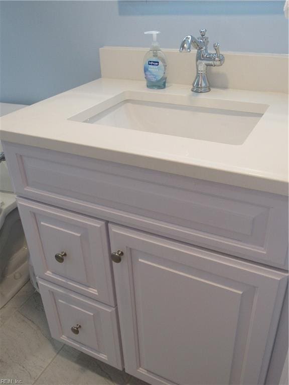 bathroom with toilet and vanity