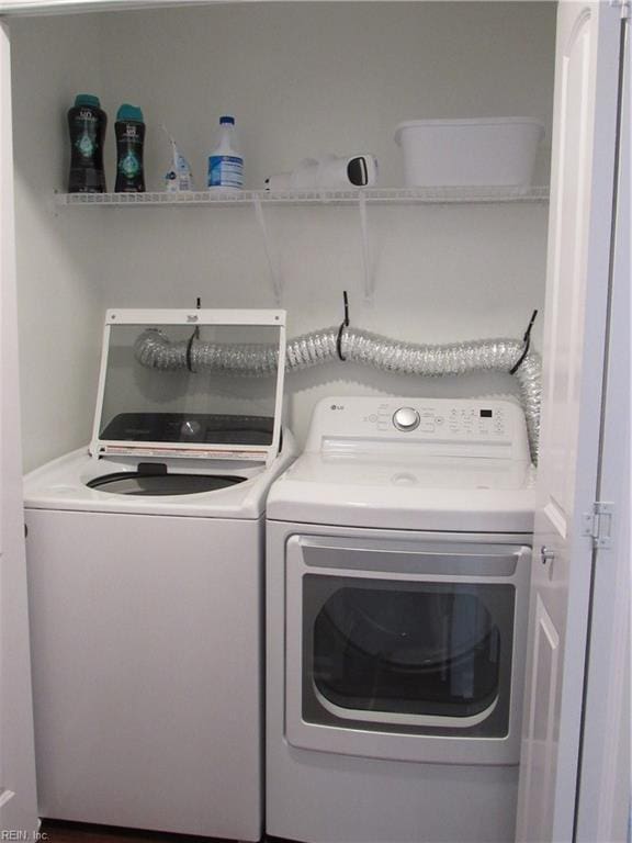 laundry area with washing machine and dryer