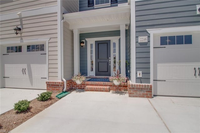 doorway to property with a garage