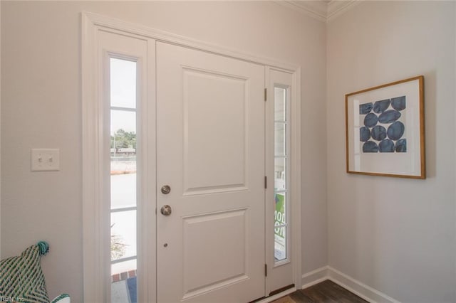 entryway featuring dark hardwood / wood-style flooring and ornamental molding