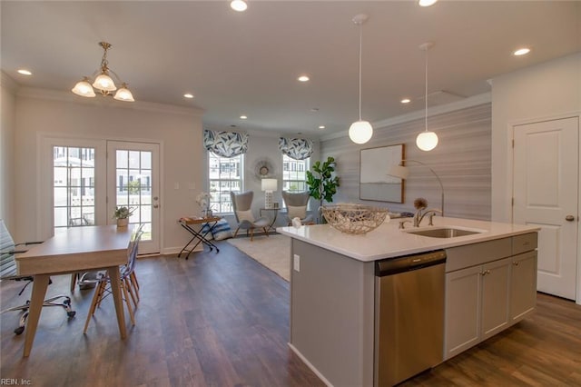 kitchen with dishwasher, sink, hanging light fixtures, an island with sink, and ornamental molding