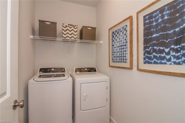 clothes washing area featuring independent washer and dryer