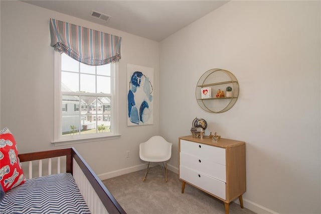 bedroom featuring light carpet