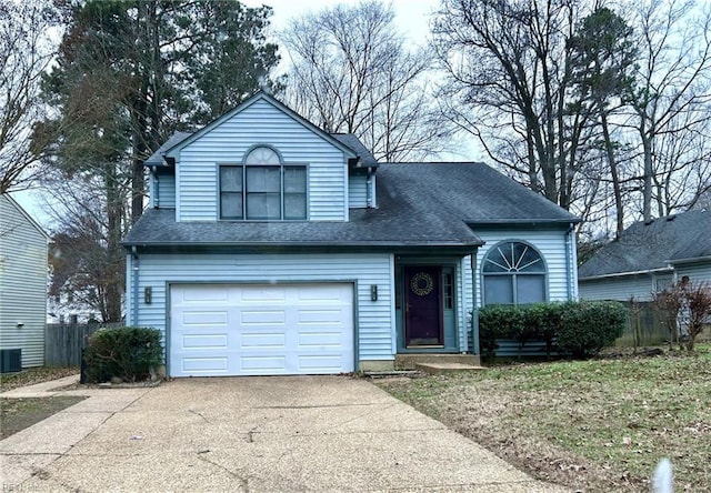 front of property featuring a garage and central AC