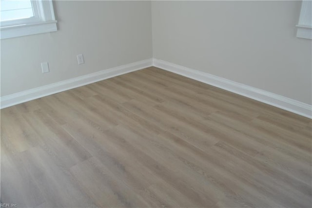 empty room with light hardwood / wood-style floors