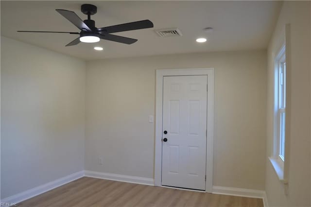 spare room featuring ceiling fan and light wood-type flooring