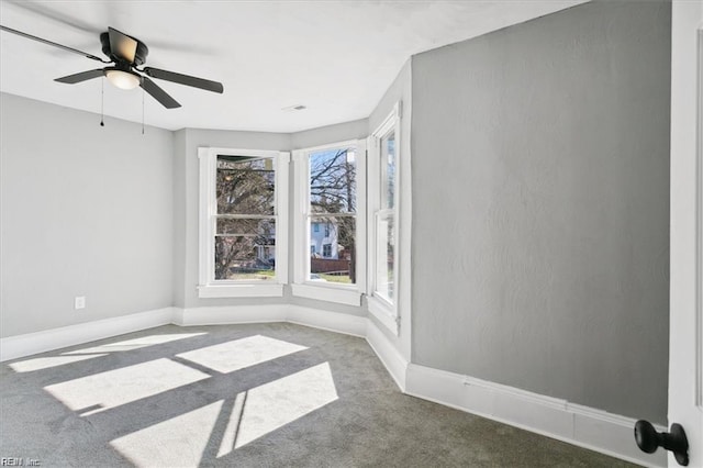 carpeted empty room with ceiling fan