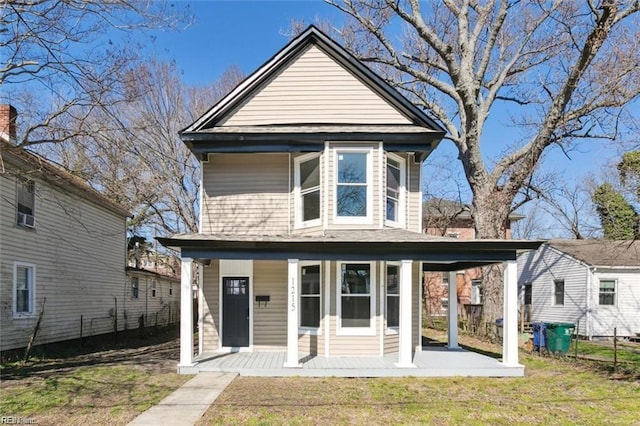 view of front of property with a front lawn and a porch