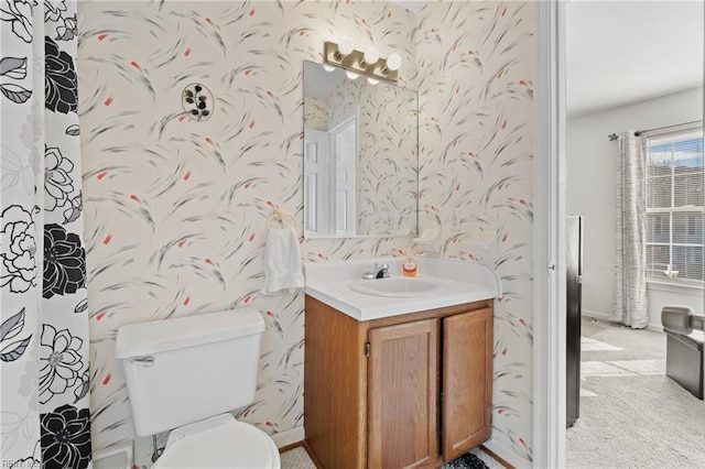 bathroom with vanity and toilet