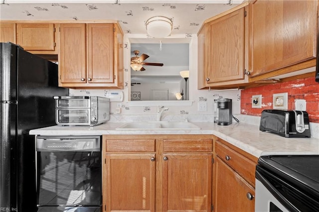 kitchen with sink, black dishwasher, and ceiling fan