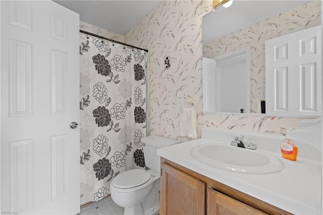 bathroom with tile patterned floors, toilet, a shower with shower curtain, and vanity