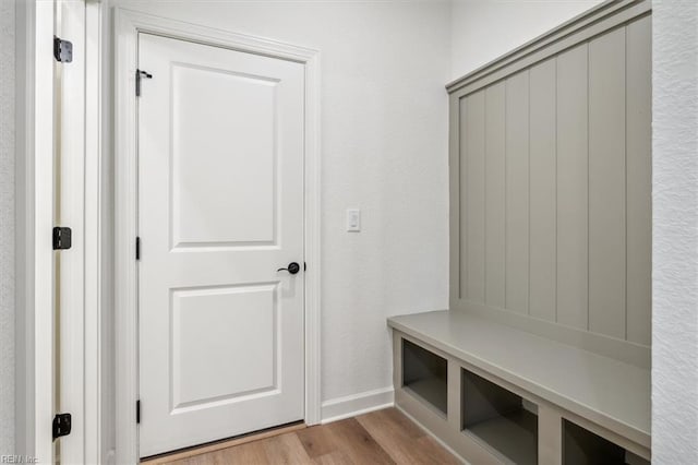 mudroom with light hardwood / wood-style flooring