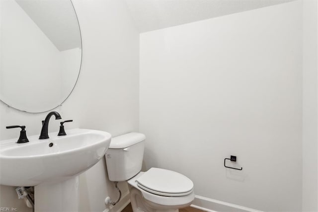 bathroom with toilet and sink