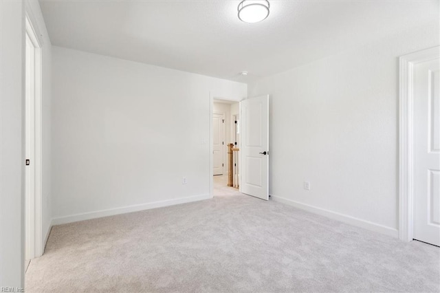 unfurnished bedroom featuring light colored carpet