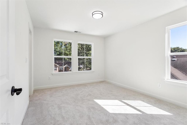 empty room featuring light colored carpet