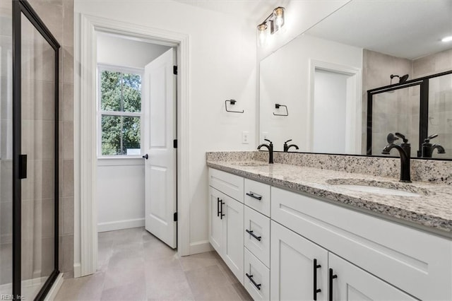 bathroom with an enclosed shower and vanity