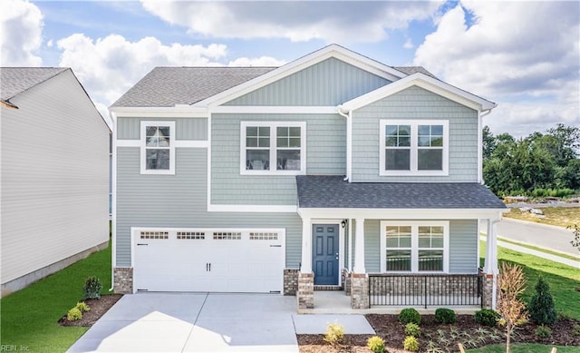 craftsman-style home featuring a garage and a porch