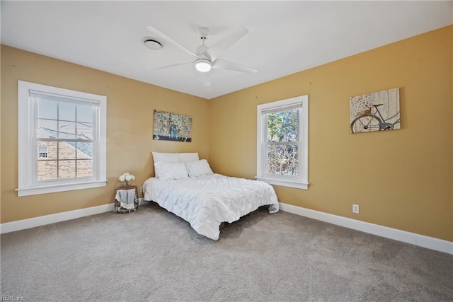 bedroom with ceiling fan and carpet flooring