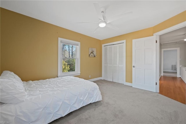 carpeted bedroom with ceiling fan