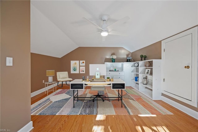 office area with ceiling fan, hardwood / wood-style floors, and lofted ceiling