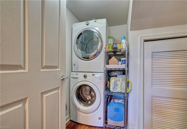 laundry room with stacked washer and clothes dryer