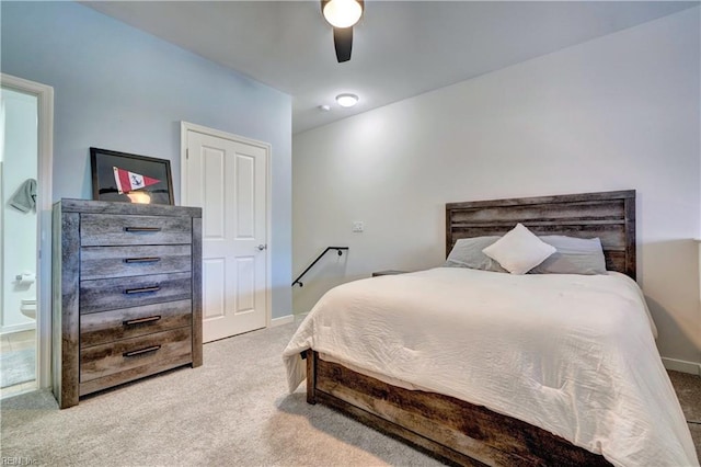 bedroom with light colored carpet and ceiling fan