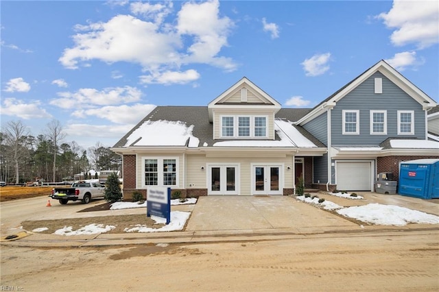 view of front of home featuring a garage and french doors