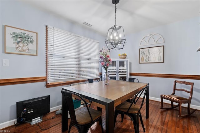 dining area with dark hardwood / wood-style floors